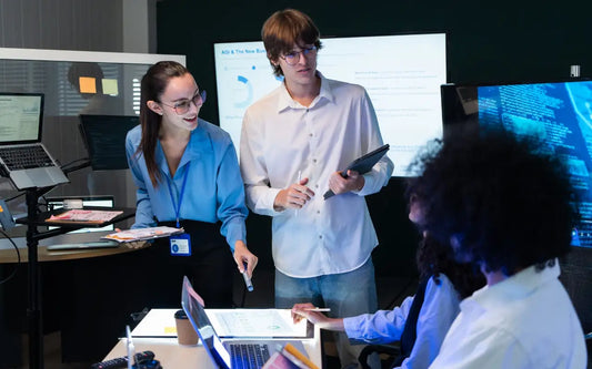 AI compliance workshop for SMEs in Spain, with professionals reviewing AI governance frameworks, regulatory obligations, and risk reduction strategies for 2025–2026.