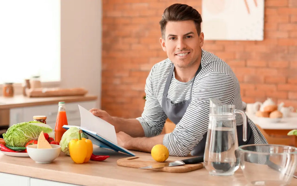 Food handler in Spain reviewing a food handlers manual PDF and food safety study materials before obtaining a food handler certificate.