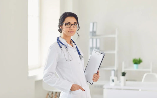 Health Data Privacy LOPDGDD-GDPR Compliance in Spain banner showing a female doctor with a clipboard in a medical office