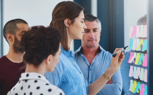 Training graphic for the course "How to Conduct a Double Materiality Assessment: A Step-by-Step Guide" showing a corporate team analyzing project strategy.