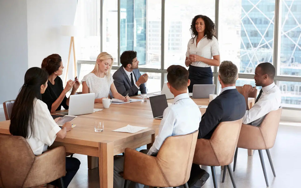 Business team in a modern office meeting to discuss GDPR compliance and fine enforcement in Spain.